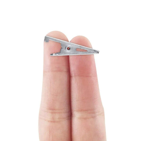 28mm Mini Metal Alligator Clip held between fingers, showing size and detail, part of 100 pack for DIY projects and automotive use.