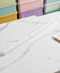 Six Piece White Abs Side Mounted Drawer Slide Rails 300Mm Grooved Guide System For Dresser Replacement on marble surface.