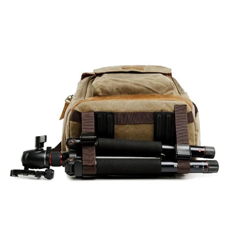Back view of Canvas Batik Camera Backpack Waterproof And Wear Resistant Ultra Large Capacity Gear Bag For Photogs with attached tripod.