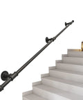 Black Wrought Iron Stair Handrail Wall Mounted Indoor Outdoor Support Bar With Kickass Ergonomic Grip Built Tough For Daily Use Senior Safety Adjustable Length Weather Resistant on stairs.