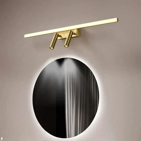 Brass Vanity Light With Adjustable LED Spotlights for Makeup Mirror, 56cm, mounted above circular mirror in bathroom setting