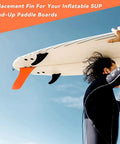 Person carrying surfboard with 9 Inch SUP Center Fin No Tool Fin Screw Fiberglass Reinforced Replacement Fin For Surfboard And Stand Up Paddleboard.