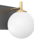 Mid Century Modern Four Light Vanity Light With Milky Glass Globes Over Mirror Dope Vintage Style Bathroom Fixtures Featuring Gold Pole And Matte Black Base For Soft Uniform Illumination close-up