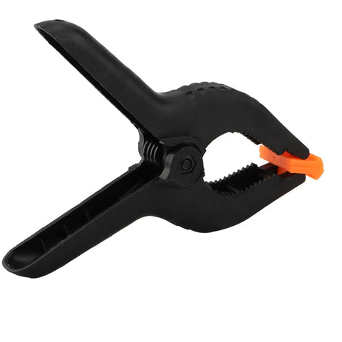 Six Pack 9 Inch Hefty Spring Clamps Made From Tough Nylon With Cushioned Jaw Tips Engineered For Knockout Grip Efficiency And Quick Swaps On Woodworking Or Photo Studio Crafting Sessions - close-up angle of a single clamp