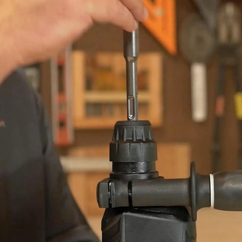 Inserting bit into Hard Hitting Rotary Hammer Drill With SDS Plus, 1-Inch Chuck, 7.5 Amp Power For Fast Drilling in Concrete, Model DH26PF