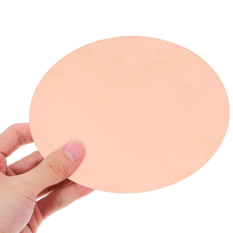 Copper Round Plate 0.5mm Thick, 150mm Diameter Solid Copper Sheet For DIY Repairs, Handyman Projects, Industrial Use, And Craft Supplies held in hand