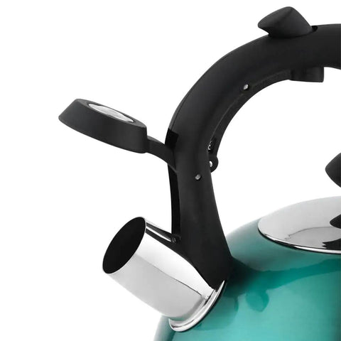 Close-up of a stainless steel whistling tea kettle with ergonomic handle, teal color, 2.3 liter capacity, ideal for fast boil and daily use.