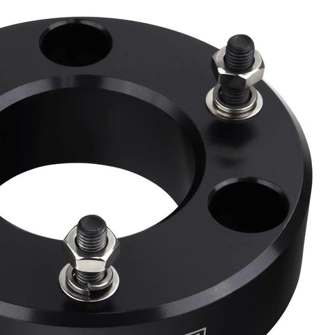 Keep Your Pickup Tight And Lifted With This 3 Inch Front Leveling Kit Built For Chevy Silverado 1500 And GMC Sierra 1500 Trucks Using Rugged T6 Billet Aluminum Strut Blocks That Smooth Out The Dash And Make Weekend Trails Feel Like A Dream Cruise - Close-up of T6 billet aluminum strut block with mounting hardware.