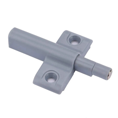 Close-up view of a gray ABS plastic silent push open cabinet door catch from the Ten Pack Silent Push Open Cabinet Door Catches With Sticky Bumpers To Keep Kitchen Cupboards Wardrobes And Drawers Closed Without Noise Or Hardware Damage For A Super Clean Modern Look.