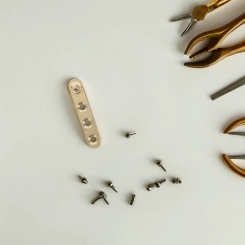 Eight Pack Copper Self Closing Pivot Door Hinges With Concealed Top And Bottom Design screws and tools on white background