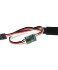Side view of a 1-piece 5-6V steering gear slow servo delay module with red, black and white wires and a green PCB.