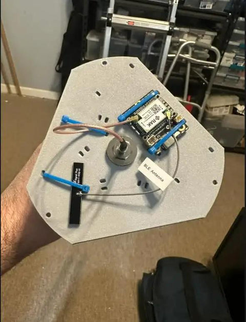 Heavy Duty Solar Hanging Enclosure For LoRa Nodes, showing internal wiring and BLE antenna in rugged white plastic.