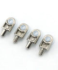 Close-up of four silver metallic connectors with white accents on a white background, details of industrial-grade design and finish.