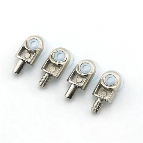 Close-up of four silver metallic connectors with white accents on a white background, details of industrial-grade design and finish.
