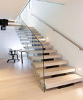 Heavy Duty Stainless Steel Handrail Kit For Indoor And Outdoor Decks Stairs And Balconies With No Sweat Wall Mount Setup and Pro Grade Two Inch Tubing Safety Guard Rail System securing modern floating stairs with glass.