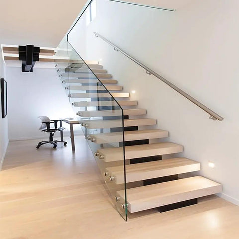 Heavy Duty Stainless Steel Handrail Kit For Indoor And Outdoor Decks Stairs And Balconies With No Sweat Wall Mount Setup and Pro Grade Two Inch Tubing Safety Guard Rail System securing modern floating stairs with glass.