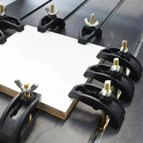 Six Pack CNC Arcuate Press Plate Clamps T Slot Hold Down Fixture securing material on a milling machine table.