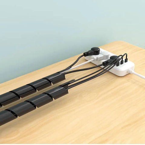 Spiral Cable Wrap 1/2 Inch Black, 23 Ft Long Wire Organizer on wooden table for cable management, protecting wires from wear