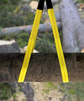 Two yellow nylon lift sling straps with black ends, front view draped over a log; 6.5 ft, 13,000 lb capacity (2-pack)