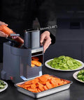 Front view of gray 4-in-1 electric vegetable slicer and chopper with dual feed chutes.