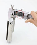 Digital caliper measuring a stainless steel hinge, showcasing precision reading at 10.99 mm, ideal for accurate sizing.