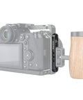 Top Shelf Camera Mounting Plate Cheese Bar Extension featuring 1/4 and 3/8 inch threads attached to a camera with a wooden grip.
