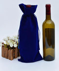 Four Pack Flannelette Wine Bottle Bags With Drawstrings For Travel Gift Packaging And Party Supplies Fabric Bottle Covers next to bottle
