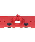 Red plastic woodworking hinge hole jig with 35mm drilling guide and two black adjustment knobs