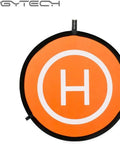 Orange drone landing pad from the Mavic 2 Zoom Drone Quadcopter With Dope 2X Optical Zoom 24-48mm, 12MP CMOS Sensor, Renewed Bundle