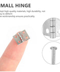75 Pcs Mini Copper Vintage Hinges With Screws For Wooden Crafts And Jewelry Boxes, shown close-up on a fingertip.