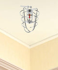Rock Solid Heavy Duty Fire Sprinkler Head Guard Sturdy Iron Metal Shield Cover For Ceiling Pipe Setup Durable Cage Protector Built Tough As Nails For Commercial Facilities Knockout Protection ceiling-mounted iron guard with protective cage.
