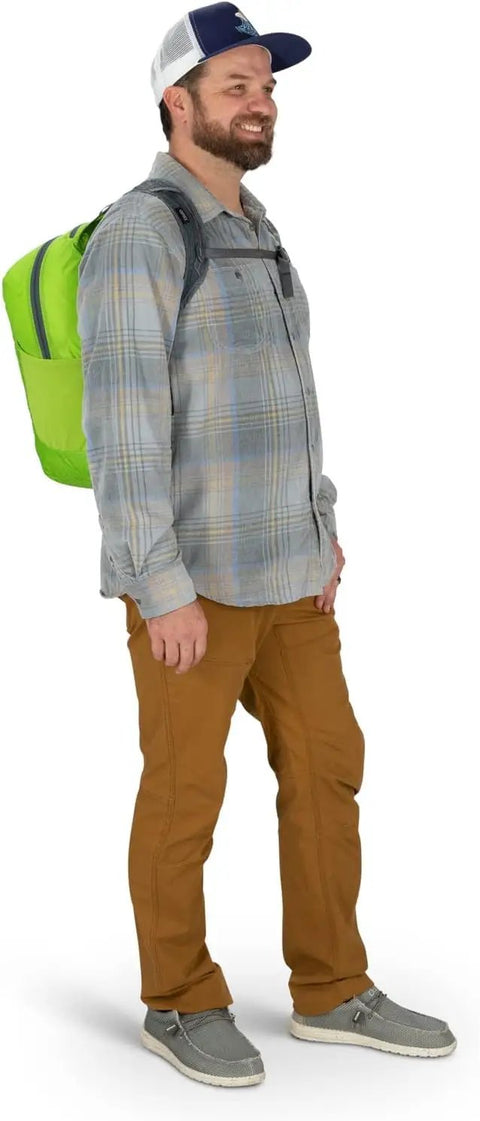 Man wearing a Lightweight Collapsible Day Pack For Travel And Everyday Use 18L Capacity Packable Luggage Expansion Bag in green.