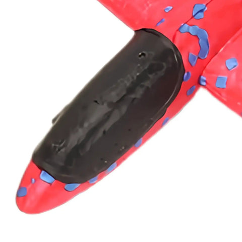 Close-up of nose tip on red Hand Launched Foam Airplane Toy For Backyard Fun Easy Throw Glider With Safe Soft Foam.