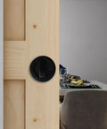 Invisible Barn Wood Sliding Door Lock Hardware With Cup Handle And Keys, Black Finish, 2.95 Inch Diameter, Zinc Alloy Pocket Door Lock for Barn Doors installed on wooden barn door.