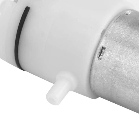 Heavy Duty 12V DC Mini Air Pump That Keeps It Quiet While Kickin Out Steady 2 To 3 Point 2 LPM Flow showing aluminum housing and air outlet.