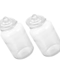 Two 2 liter airtight glass tea canisters from the Level Up Your Pantry Setup With These Hella Tough set, perfect for storage.