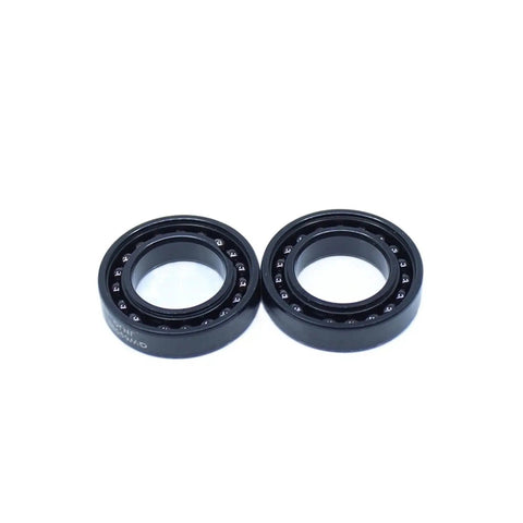 Heavy Duty High Temperature Ball Bearings With Rock Solid Cast Iron Housings Rated For 500 Degrees Celsius, two black ball bearings.