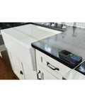 Blaze Green Beam Laser Measure on sleek countertop showing precise 165 ft real-time readings, for pros and DIYers.
