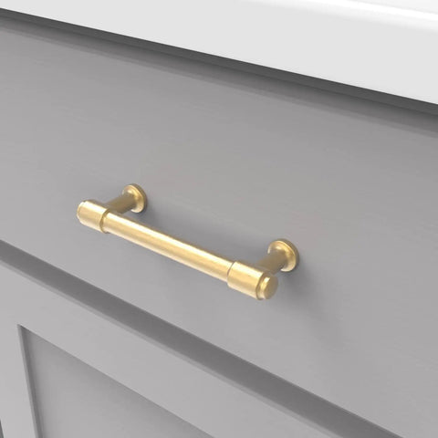 Gold cabinet pull on gray drawer, similar style to 10 Pack Solid Core Chrome Cabinet Pulls For Kitchen And Bath, Luxury Handles For Doors.