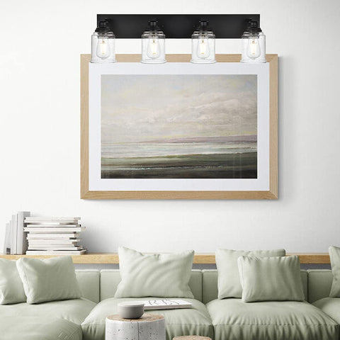 Black Vanity Lights 4-Light Modern Farmhouse Wall Fixtures With Seeded Glass Shades above a framed painting over a couch