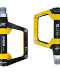 Yellow and black aluminum mountain bike pedals flat pedals for MTB and BMX with removable non-slip studs nine sixteenths inch