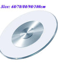 60cm Tempered Glass Lazy Susan Turntable for dining tables, 360 degree rotating serving plate, shown at an angle.