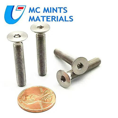 Kickin Style Titanium Bolts M5x30mm Countersunk Flat Head Fasteners Multicolor Heavy Duty Hardware For Motorcycle Chassis Bike Frames And Vehicle Mods Built Sick Ride Ready Gear Pack with a penny for size reference.