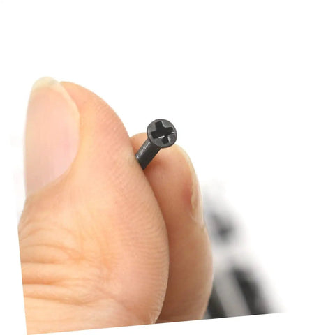 Close-up of a tiny screw from the Two Piece Miniature Screw Set With 18 Different Sizes Flat Head And Round Head Tiny Screws For Glasses