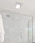 Super Quiet 90 CFM Bathroom Exhaust Fan With Built In LED Light, installed on a bathroom ceiling with white grill, 1 sone noise level.