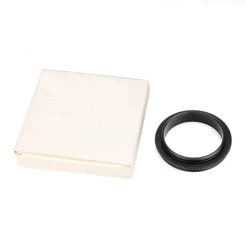 M48 to M42 telescope adapter with knurled aluminum body next to packaging, anodized black finish, no fuss mounting, ultra short length