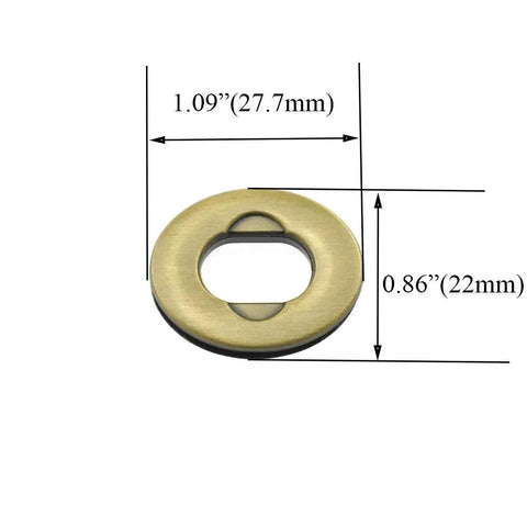 Close-up of antique-brass round purse closure turn-lock with washers; metal hardware, 1.1 in diameter.