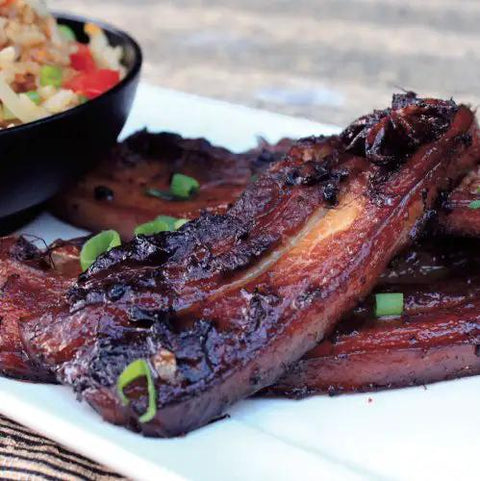 Quick Fix Thermomix Recipe Book Loaded With Easy Weeknight Dinners And Killer Meal Prep Hacks Perfect For Busy Home Cooks Looking To Knock Out Tasty Homemade Feats Daily, featuring grilled ribs on a plate.