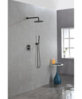 Shower System, 10" Rain Head, Handheld, Matte Black, Wall-Mounted installed in modern bathroom setting.