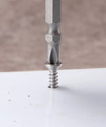 Close-up of Number Ten By One And A Half Inch Sheet Metal Screw being installed in surface, showing stainless steel finish.